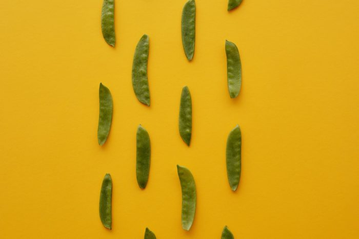peas on a yellow background
